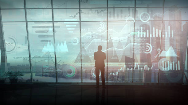istock A businessman standing in his office works with an array of infographics. 1279887919