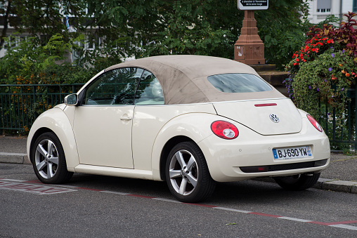 Mulhouse - France - 27 August 2020 - Rear view of beige Volkswagen new beetle parked in the street