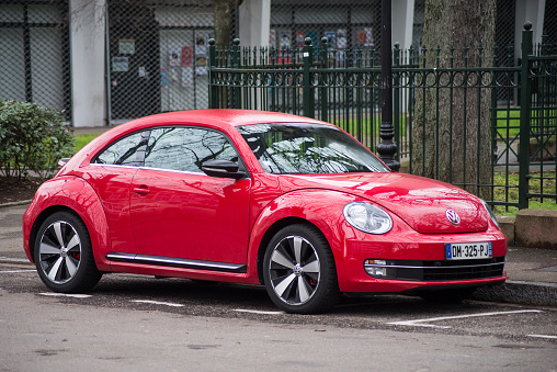 Mulhouse - France - 19 January 2020 - Front  view of red Volkswagen new beetle Parked in the street