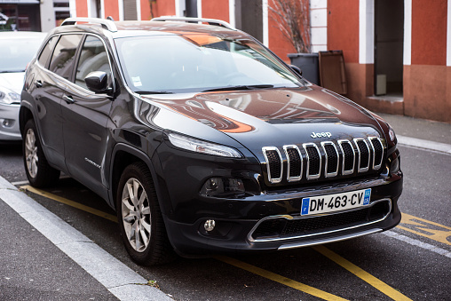 Mulhouse - France - 22 April 2020 - Front view of black Jeep Cherokee parked in the street