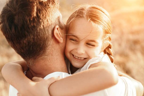 istock Happy daughter hugging father in nature 1279895903