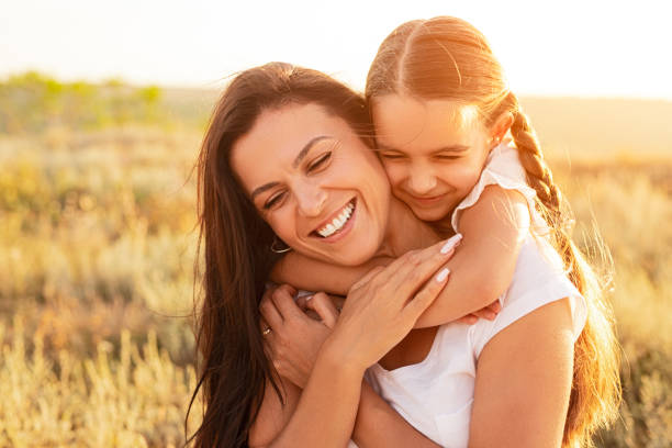 istock Daughter hugging mother in nature 1279895905