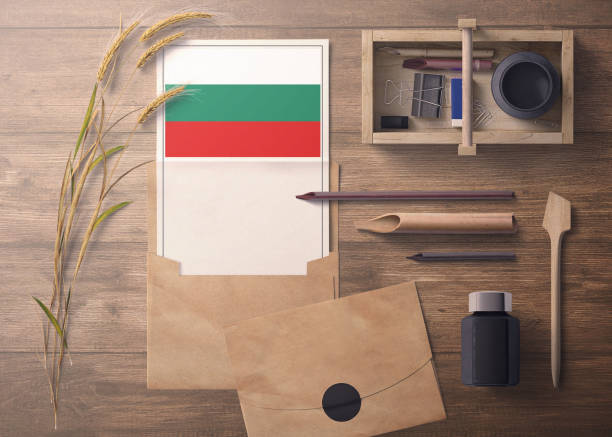 istock Bulgaria invitation, celebration letter concept. Flag with craft paper and envelope. Retro theme with divide, ink, wooden pen objects. 1279896300