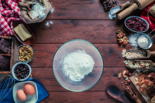 istock Chocolate and nuts cookie making on rustic table with digital food weight scale.  Christmas themes. 1279903360