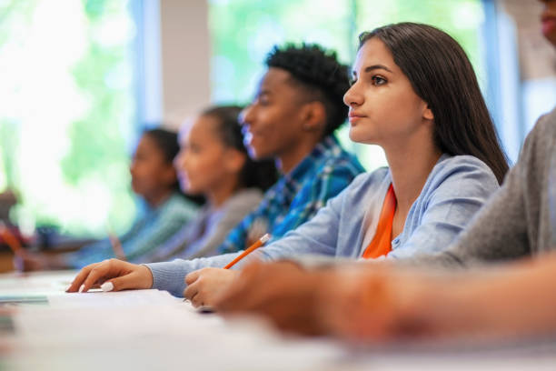 istock Asian female student attending lecture desk in classroom 1279904248