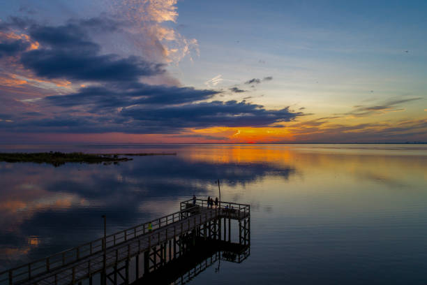 istock Autumn sunset on Mobile Bay 1279906430
