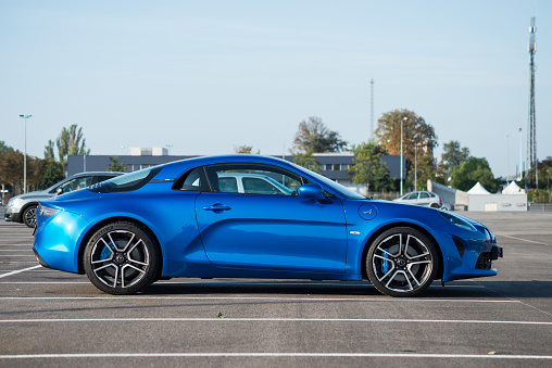 Mulhouse - France - 12 September 2020 - Profile view of blue Renault Alpine A110 parked in the street