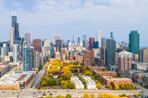 Aerial View of Chicago Cityscape and Fall Colors Aerial View of Chicago Cityscape in Autumn chicago illinois photos stock pictures, royalty-free photos & images