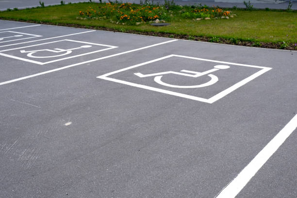 istock Road markings. Parking for disabled people and people with disabilities. 1279910053