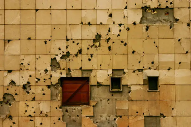 Bullet holes on wall of building in Sarajevo, Bosnia and Herzegovina