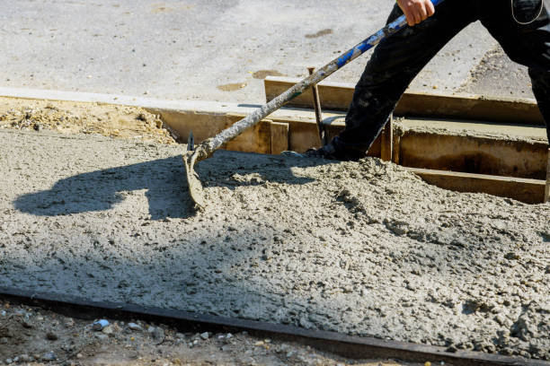 istock Cement of sidewalk a new building under construction 1279914210