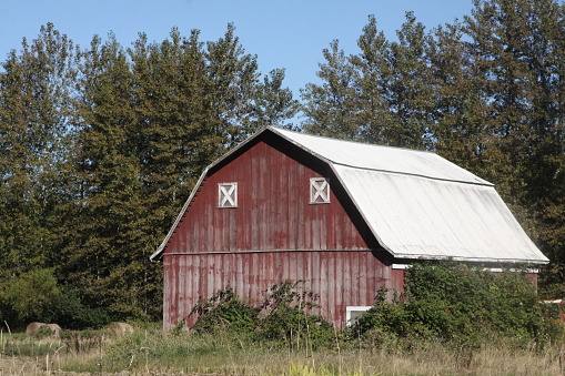 An old red barn in the countryside