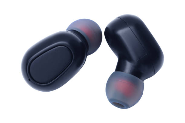 istock Small wireless headphones isolated on white background. 1279919590