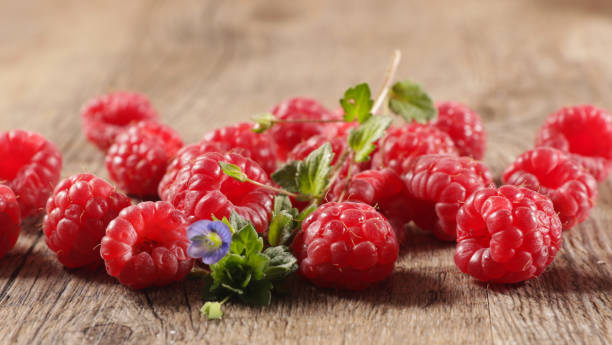 istock fresh raspberries fruits and leaf 1279921375