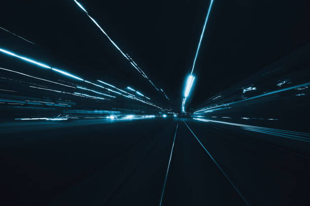 istock Abstract long exposure blurred city light trails 1279924987