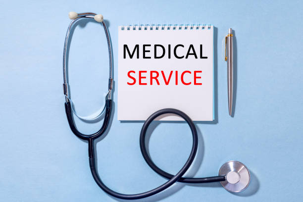 istock On a blue background stethoscope with Notepad and pen text MEDICAL SERVICE 1279925307