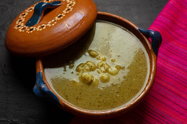 istock Mexican green pozole in cazuela on dark background 1279925630