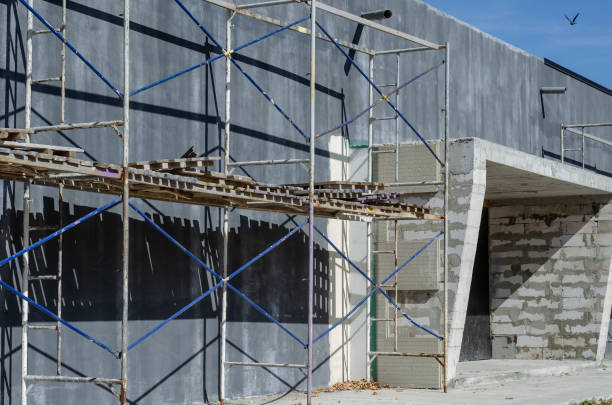 istock Scaffolding near a gray one-story building. 1279925723