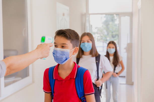 istock Temperature screening and medical check at school. 1279925886
