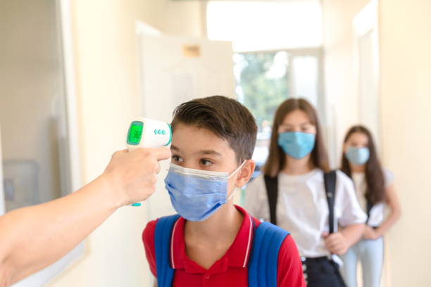 istock Temperature screening and medical check at school. 1279925898