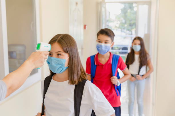 istock Temperature screening and medical check at school. 1279926872