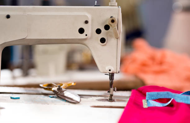 istock Sewing or tailoring industrial hall with machinery 1279928359