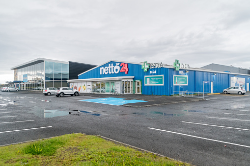 Reykjavik, Iceland - June 20, 2020: Netto 24 supermarket and Lyfja pharmacy.