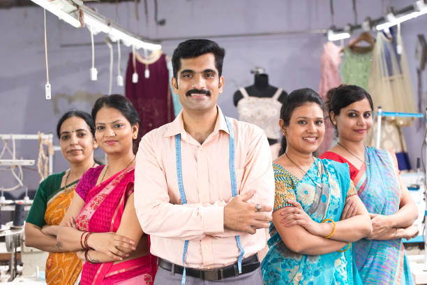 istock Textile workers standing together in solidarity 1279929429