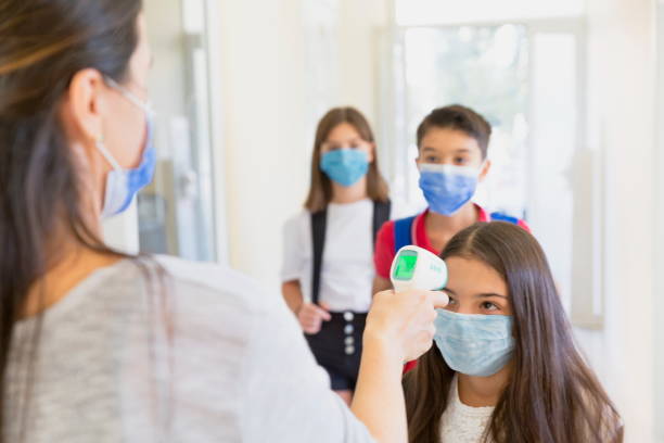istock Temperature screening and medical check at school. 1279930432