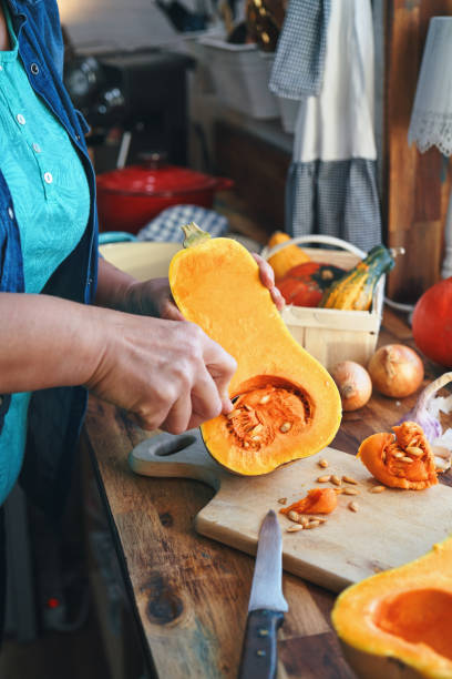istock Preparing Pumpkin Soup with Baked Pumpkins and Bacon 1279931079