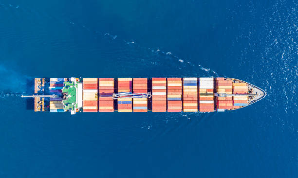 istock Cargo ship full loaded with containers, blue sea background, top view 1279932512