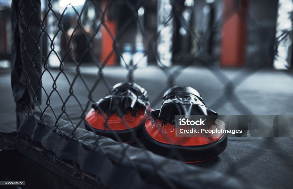 Let's get punching and sparring Still life shot of a pair of boxing mitts in a gym Mixed Martial Arts Stock Photo