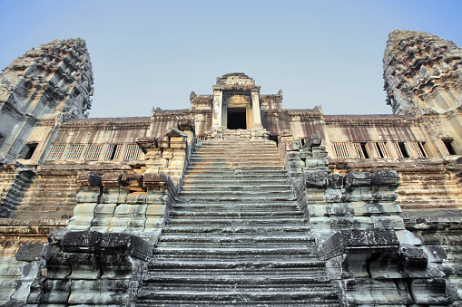 Low angle view of staircase leading to Angkor Thom temple, also called uncle Tom, in Cambodia.
