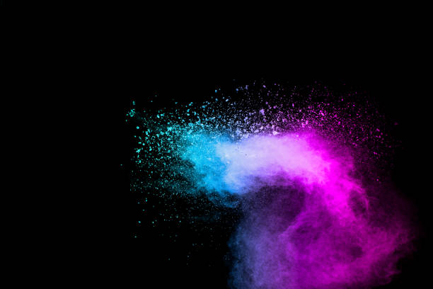 istock Pink blue dust particles splash on black background.Pink blue powder splash. 1279935745