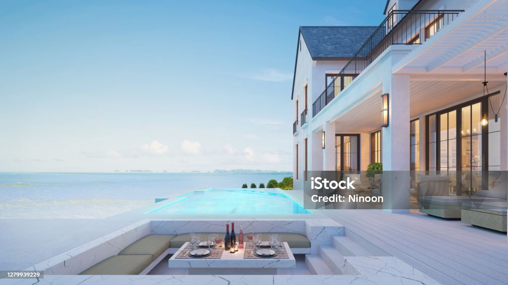 Luxury beach house with sea view swimming pool and terrace at vacation.3d rendering Luxury Stock Photo