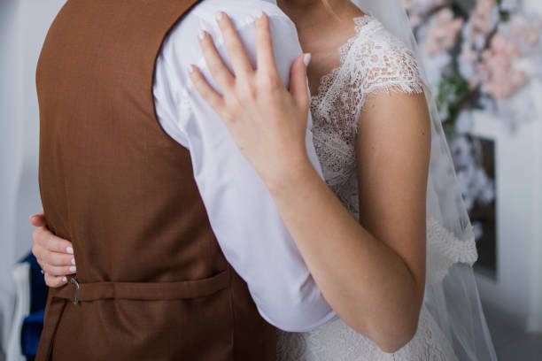 istock groom and bride in the studio hugging together 1279940498