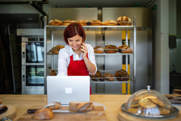 istock Bakery worker taking order by the phone 1279940715