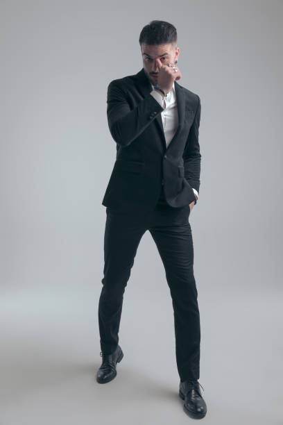 istock Handsome elegant man holding hand in pocket and scratching nose 1279941780