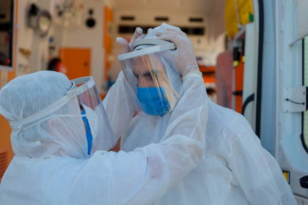 istock Medical Team in Full Infectious Disease Control Attire 1279944085