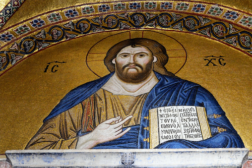 Byzantine mosaic of Jesus Christ is sitting on throne with Empress Zoe and Emperor Constantine IX Monomachus in Hagia Sophia