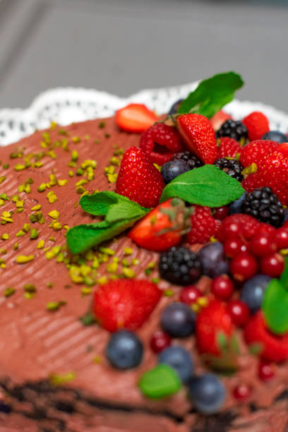 istock Vegan chocolate cake decorated with wild berries 1279946814