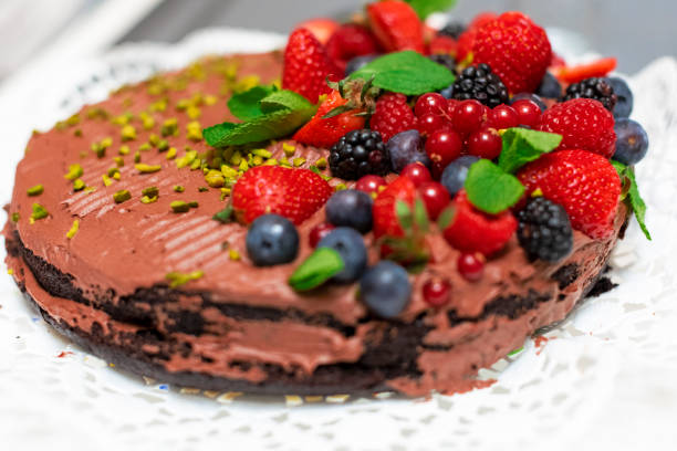 istock Vegan chocolate cake decorated with wild berries 1279946871