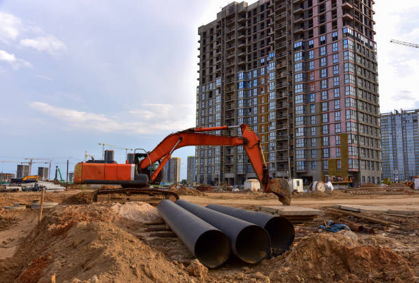 istock Excavator dig the trenches at a construction site. Trench for laying external sewer pipes 1279948071