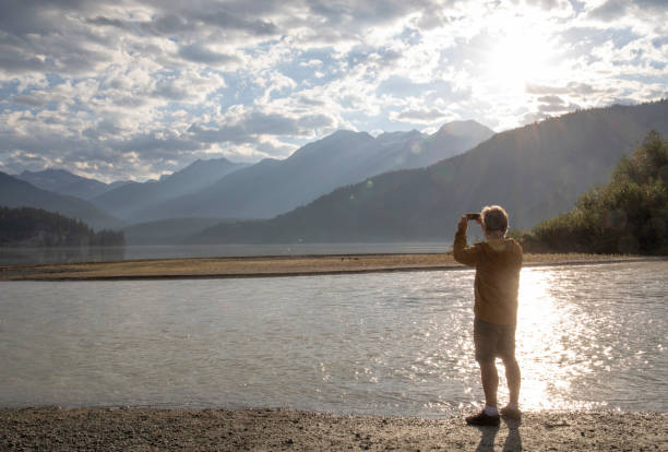 istock Hiker walks down to lakeshore at sunrise 1279951058
