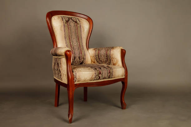 istock Old velour retro chair on gray background 1279952603