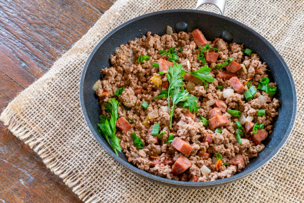 Cooked ground beef hot juicy ground beef cooked with spices, bacon and parsley in the frying pan. Cooked ground beef ground beef photos stock pictures, royalty-free photos & images