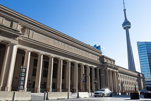 Union Station with CN Tower in the background on a busy weekday.