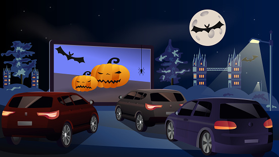 Open space auto theater. Drive-in cinema. Open-air cars are watching a movie on the movie screen. Halloween concept, with pumpkin, spiders, bat, full moon. Holiday. Vector