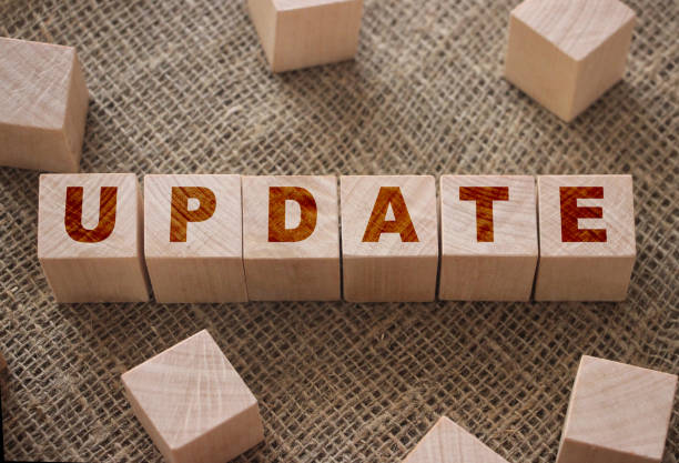 istock Update word on a wooden cubes on burlap canvas . Business technologies concept 1279960084