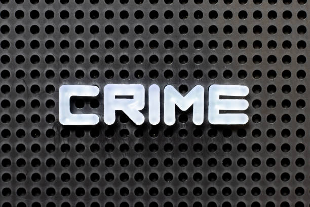 istock White color alphabet with word crime on black pegboard background 1279960811